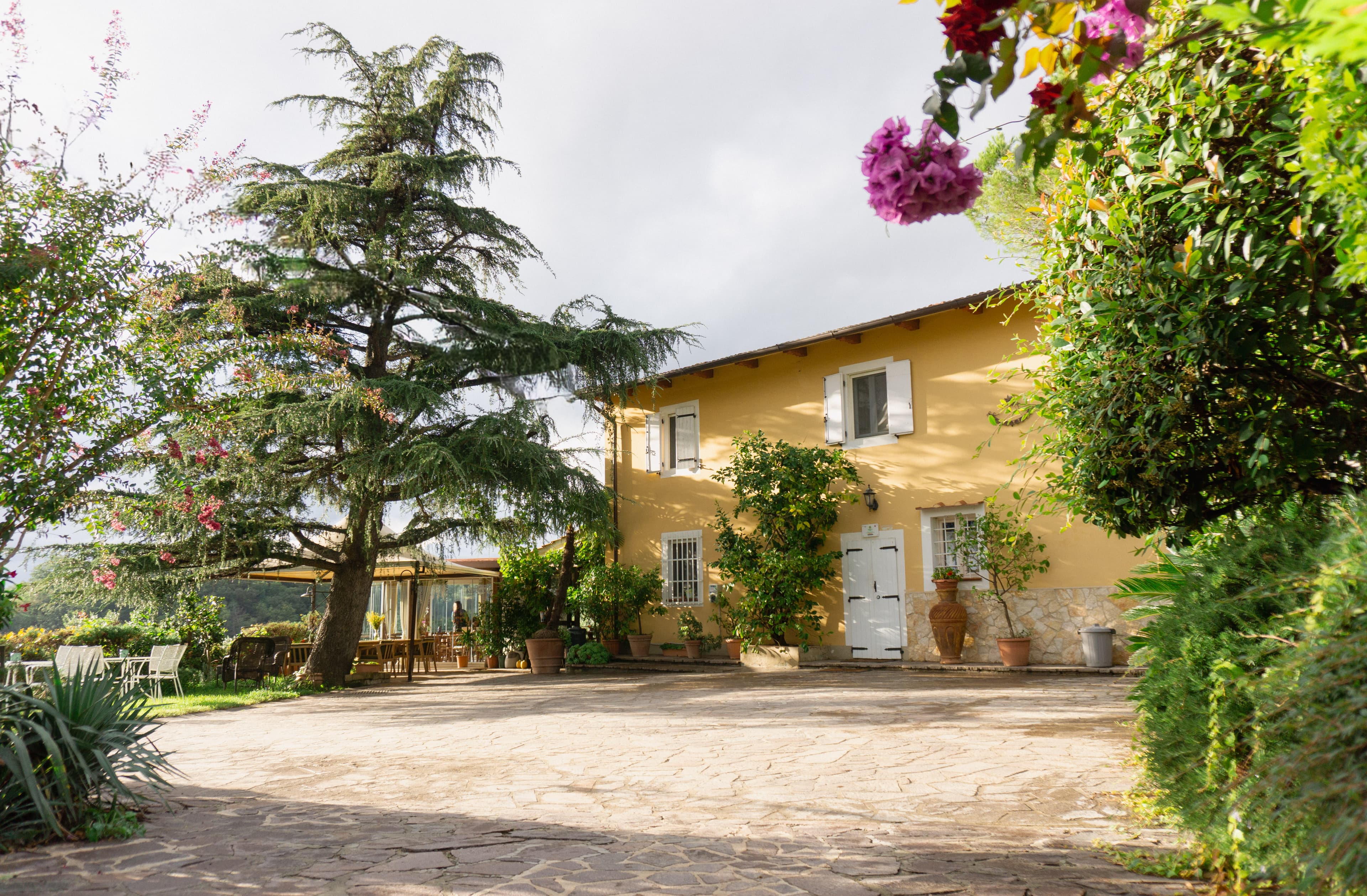 Interior view of the restored Tuscan villa featuring six bedrooms with authentic antique furnishings and panoramic countryside views